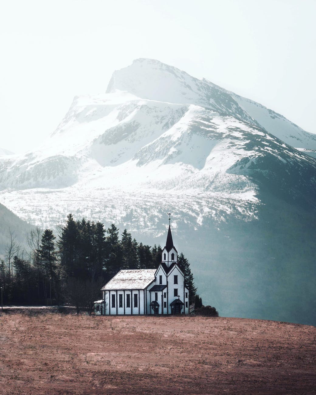 white and black church photo across white mountain