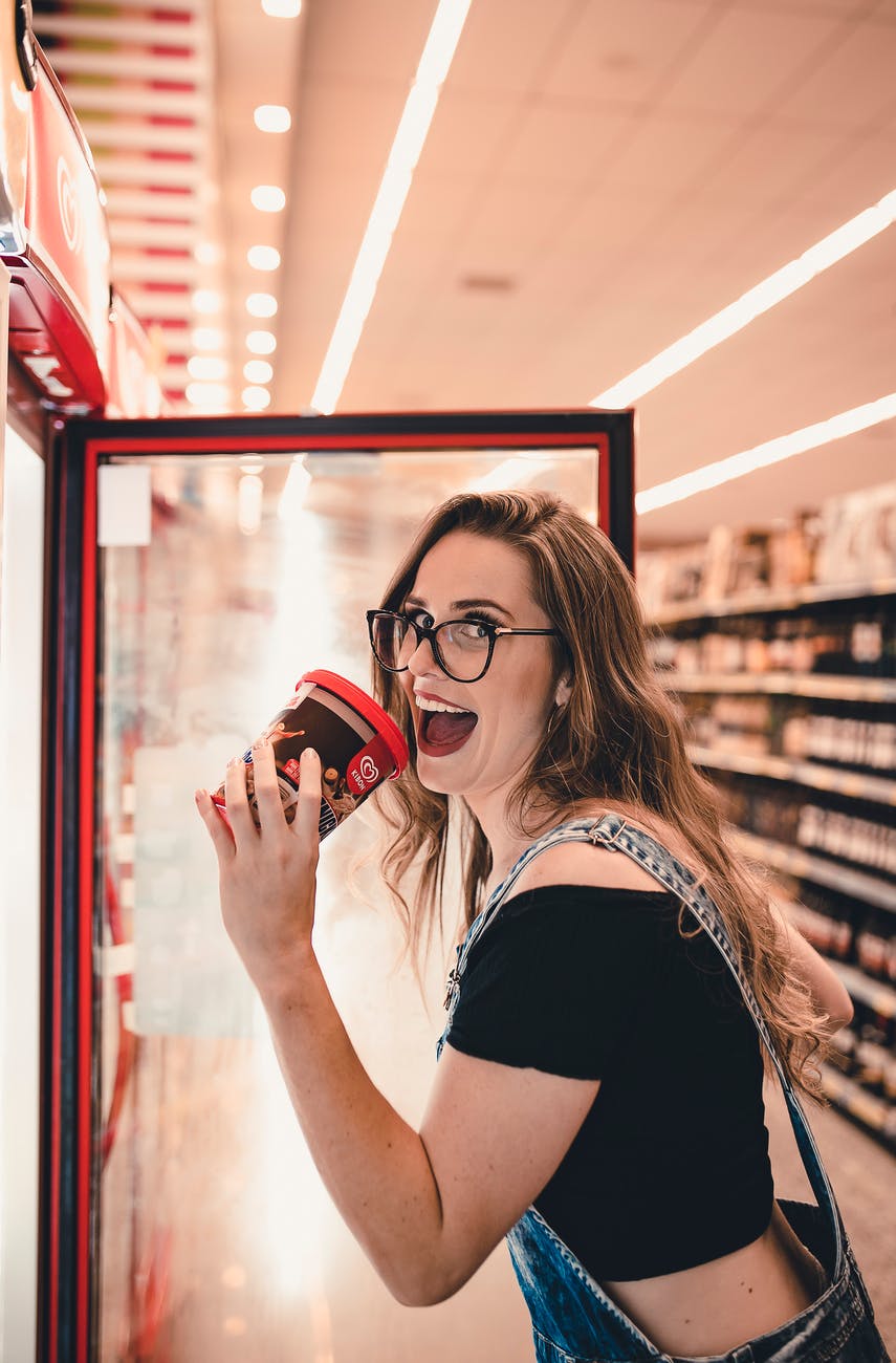 woman holding ice cream tub