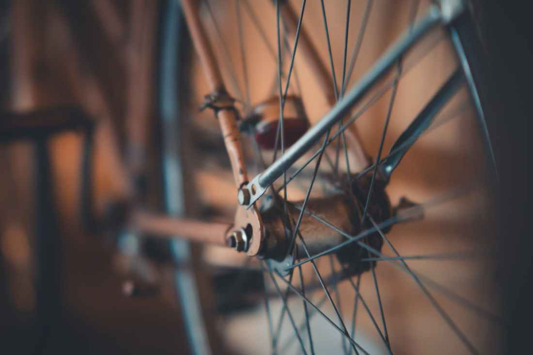 selective focus photography of bicycle wheel